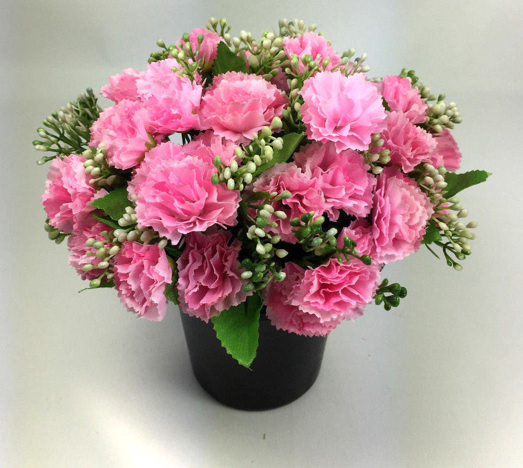 Artificial mini-carnation grave memorial pot arrangement with bright pink carnation blooms