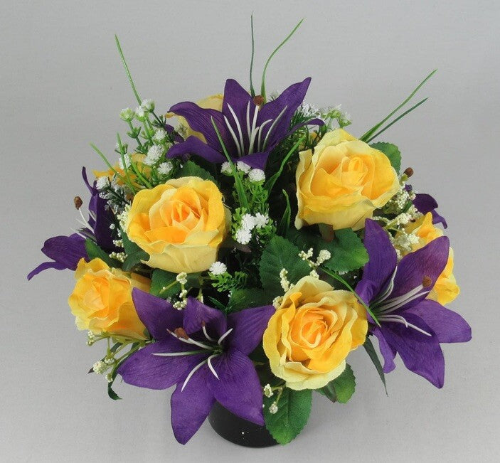 Front view artificial grave arrangement: yellow roses, purple lilies, white filler flowers