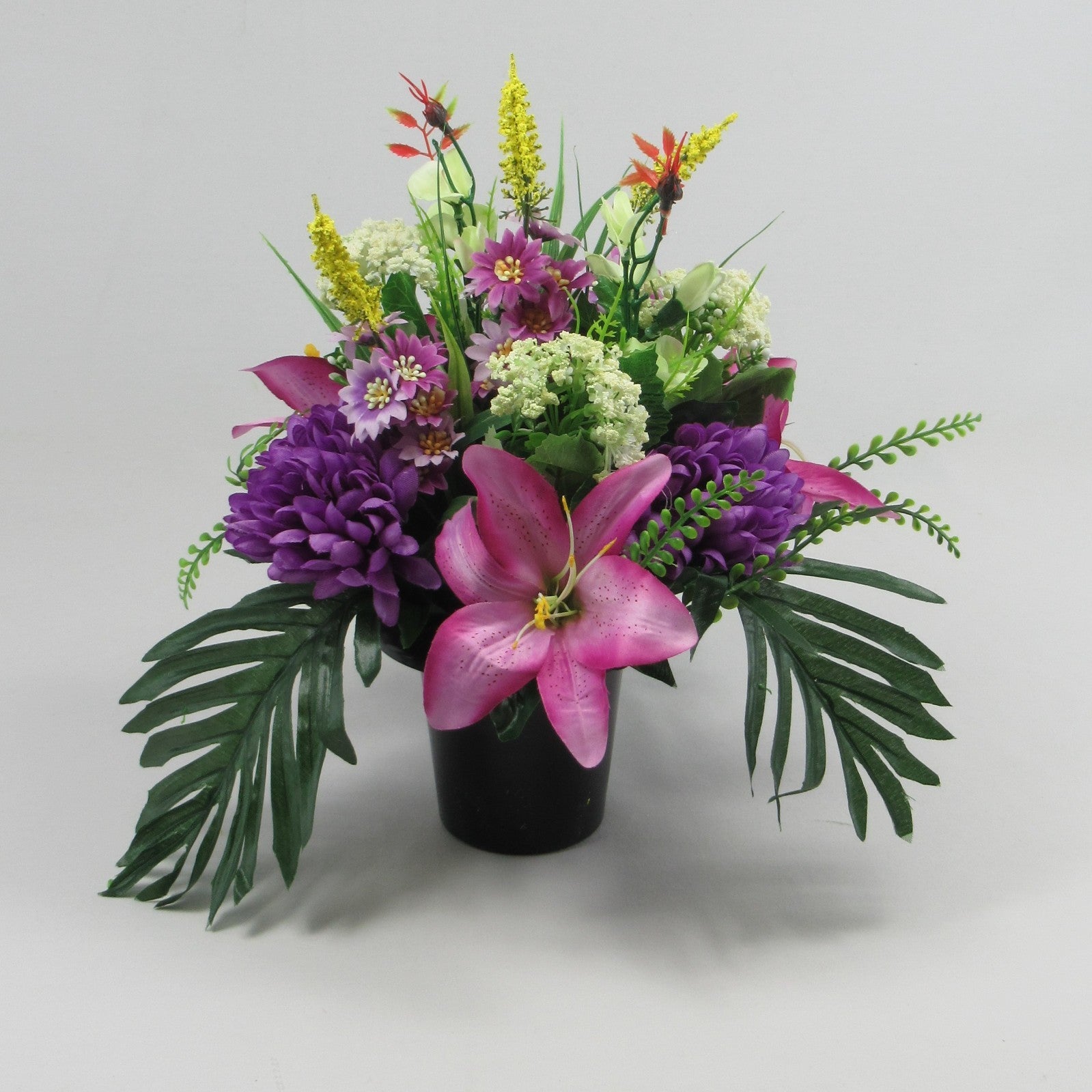Modern style grave flower arrangement with purple chrysanthemums artificial