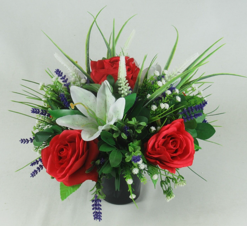 Black urn crem pot arrangement: red roses, white lily, blue lavender blooms