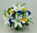 Artificial silk memorial grave pot with white lilies, yellow and blue roses, green foliage