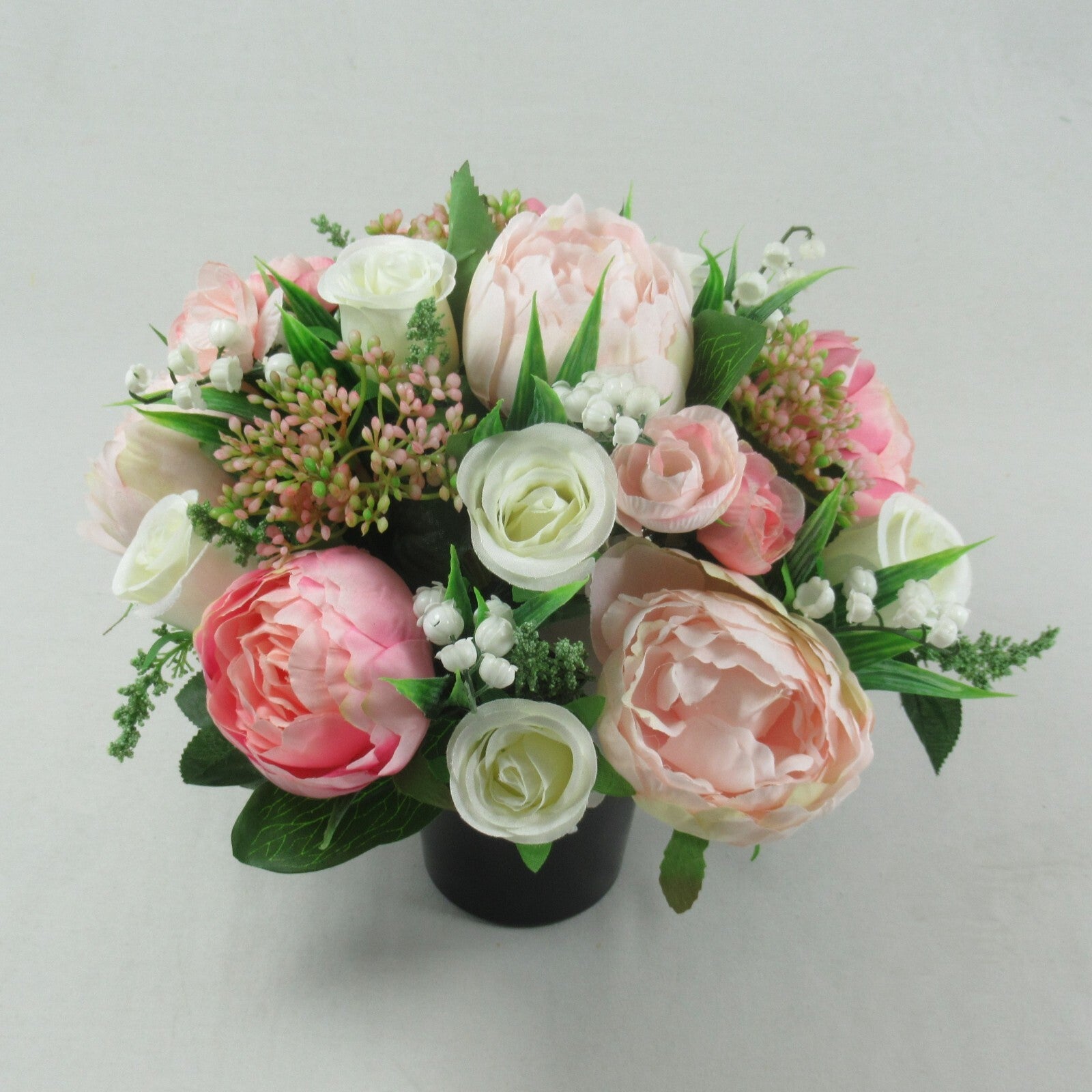 Artificial silk memorial grave pot bouquet with pink and white roses and greenery