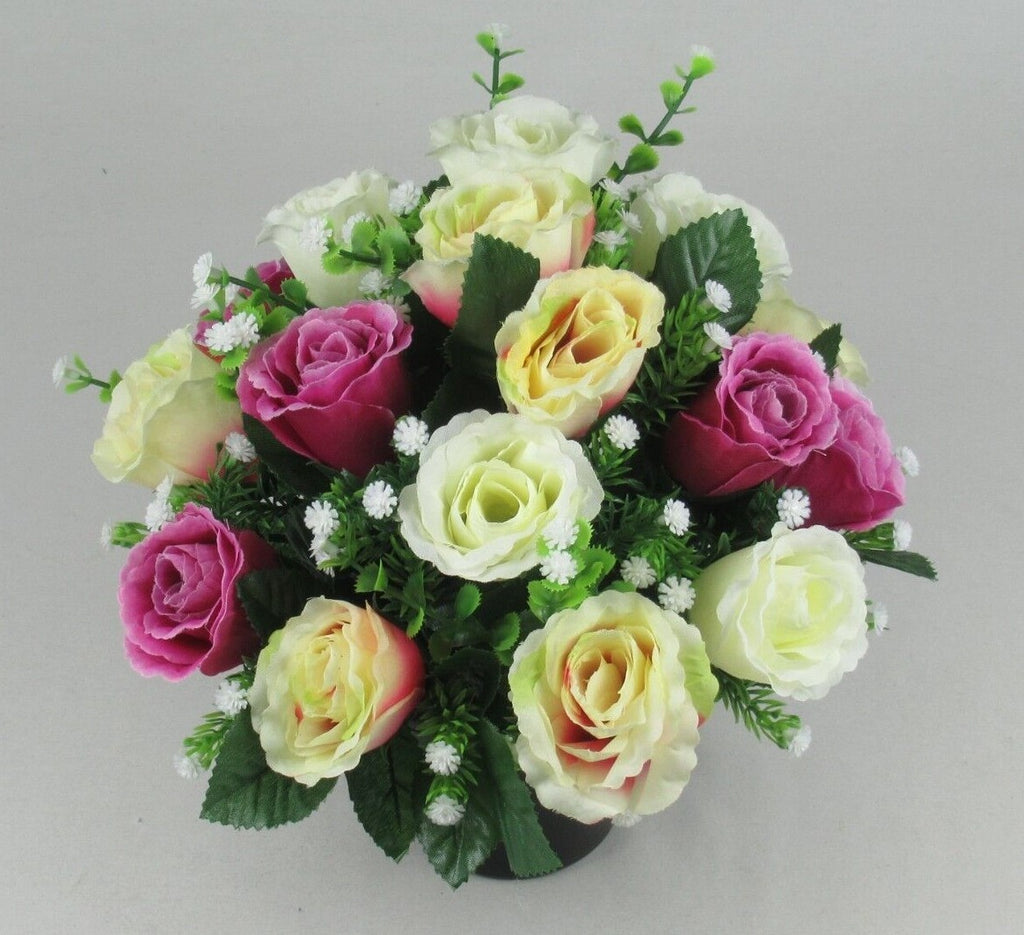 Artificial silk rose memorial grave arrangement in a dark pot, purple and white with pale yellow