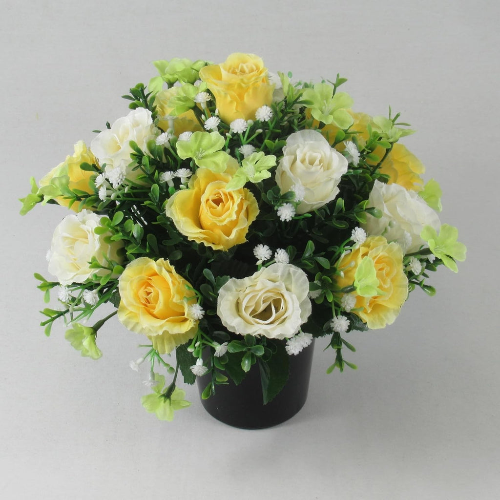 Artificial silk rose memorial crem pot with pale yellow and white roses, green leaves, black pot
