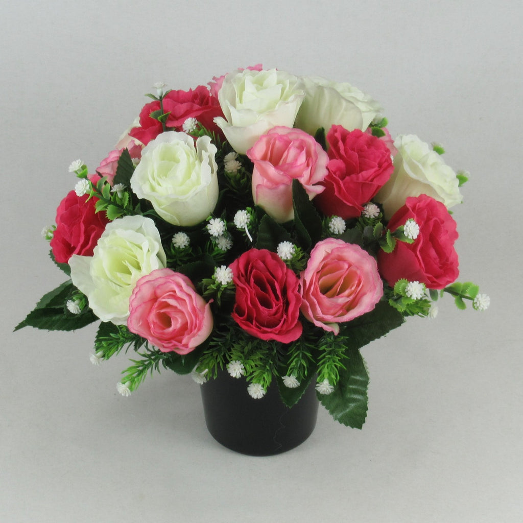 Memorial grave arrangement with pink, ivory and dark red roses in black pot