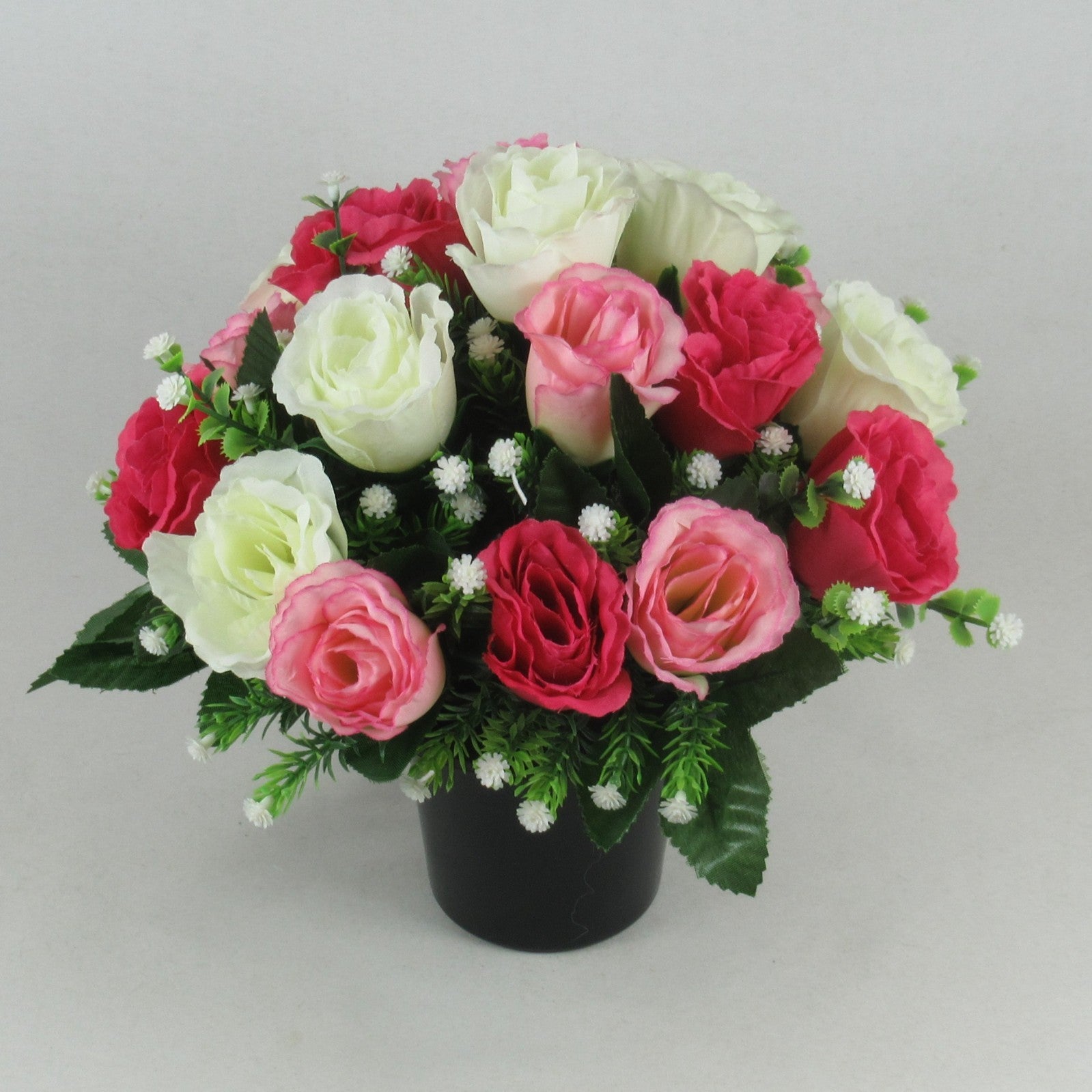 Memorial grave arrangement with pink, ivory and dark red roses in black pot