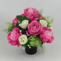 Pink and cream artificial rose and peony grave memorial bouquet in black vase