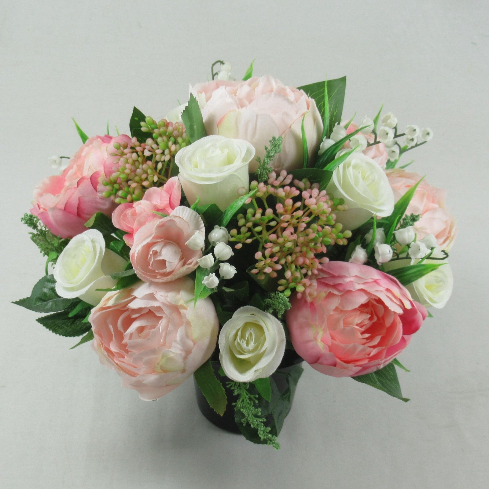 Artificial silk grave pot bouquet with cream roses, pink blooms, and white berry clusters