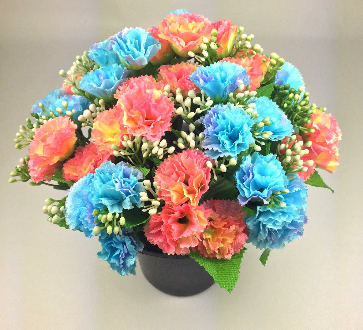Artificial silk flower grave memorial pot arrangement with blue and peach carnations