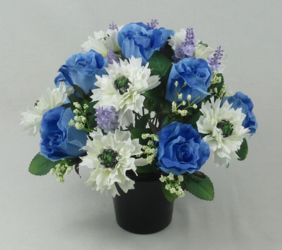Artificial memorial grave pot centerpiece with blue roses, white blossoms, purple lavender stems