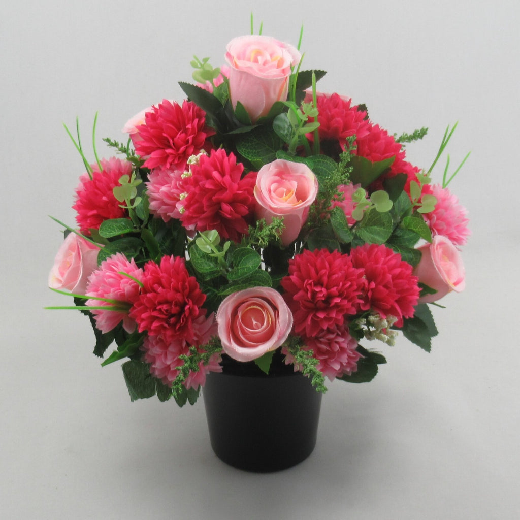 Memorial artificial bouquet: pink rosebuds with clustered red-pink flowers, dark green foliage
