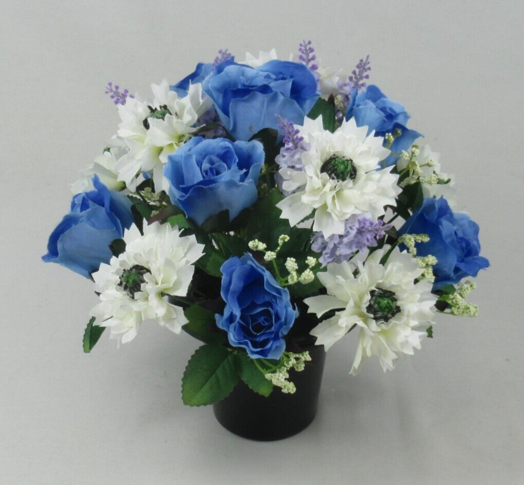 Artificial memorial pot flowers with blue roses and white blooms plus small purple sprig accents