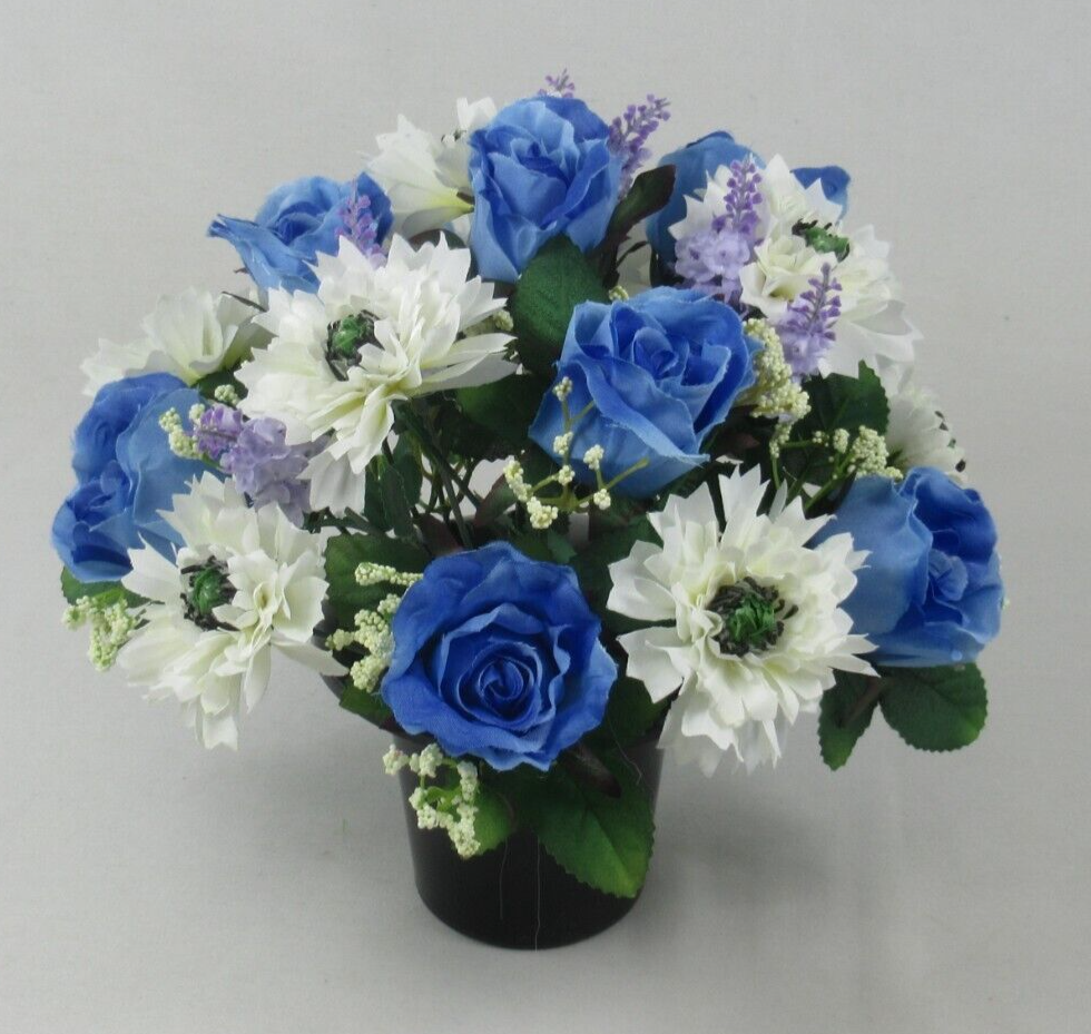 Artificial silk grave arrangement in black pot: blue roses, white daisy-like blooms, purple lavender