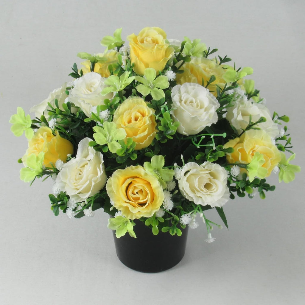 Artificial silk rose memorial crem pot with yellow/white/green blossoms in black planter