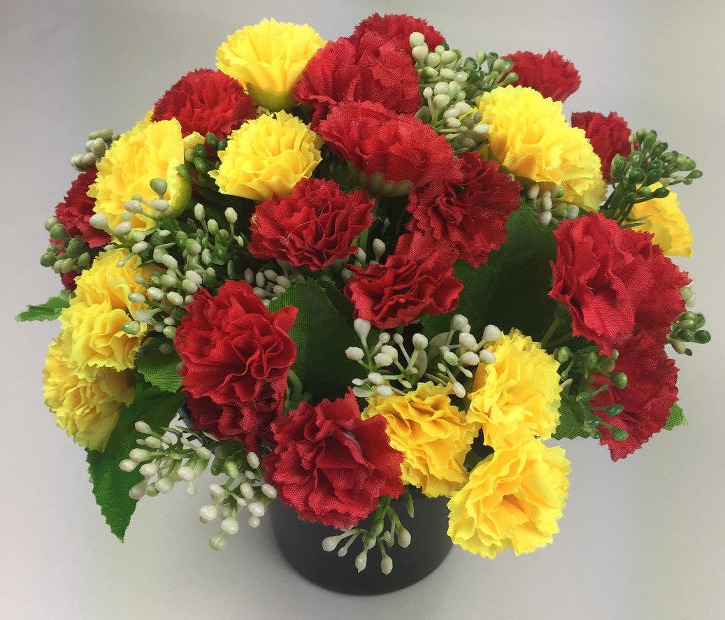 Artificial mini-carnation grave memorial pot arrangement with yellow and red carnation blooms
