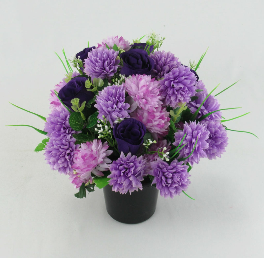 Memorial grave pot arrangement with purple and dark purple artificial flowers, black base
