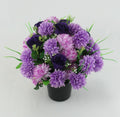 Memorial grave pot arrangement with purple and dark purple artificial flowers, black base