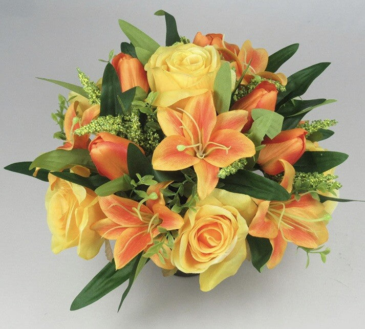 Artificial grave arrangement, open lily and roses in yellow-orange with dark green foliage