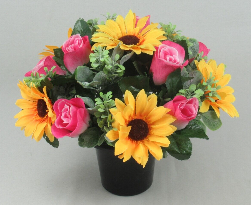 Artificial memorial flower arrangement in black pot with yellow sunflowers and pink roses