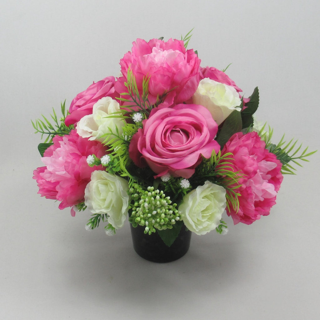 Pink rose with cream blooms and green foliage artificial grave memorial bouquet, black pot