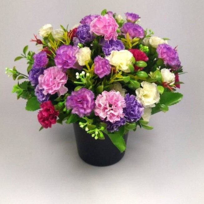 Artificial mini-carnation grave memorial pot arrangement with purple and pink carnation blooms