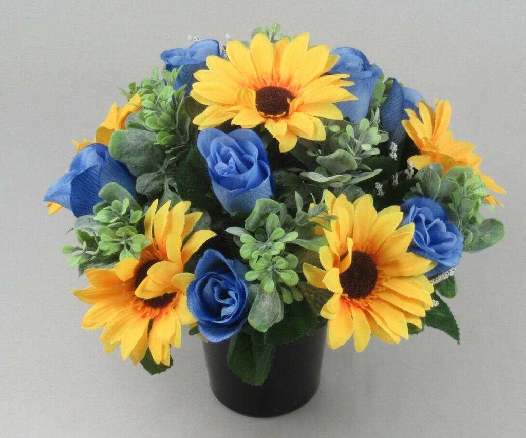 Front view artificial memorial pot with yellow sunflowers, blue roses, green leaves