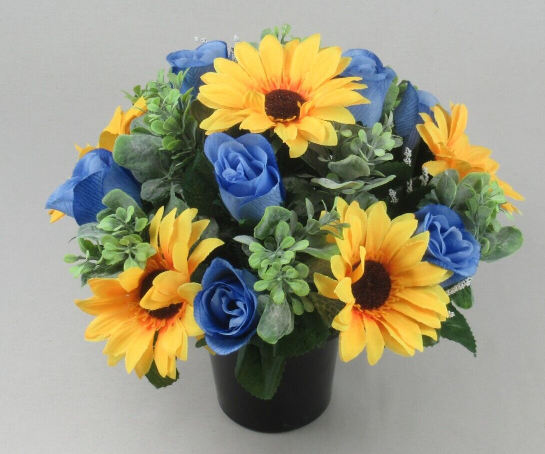 Front view artificial memorial pot with yellow sunflowers, blue roses, green leaves