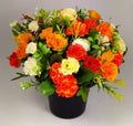 Artificial mini-carnation grave memorial pot arrangement with orange, red and white blooms