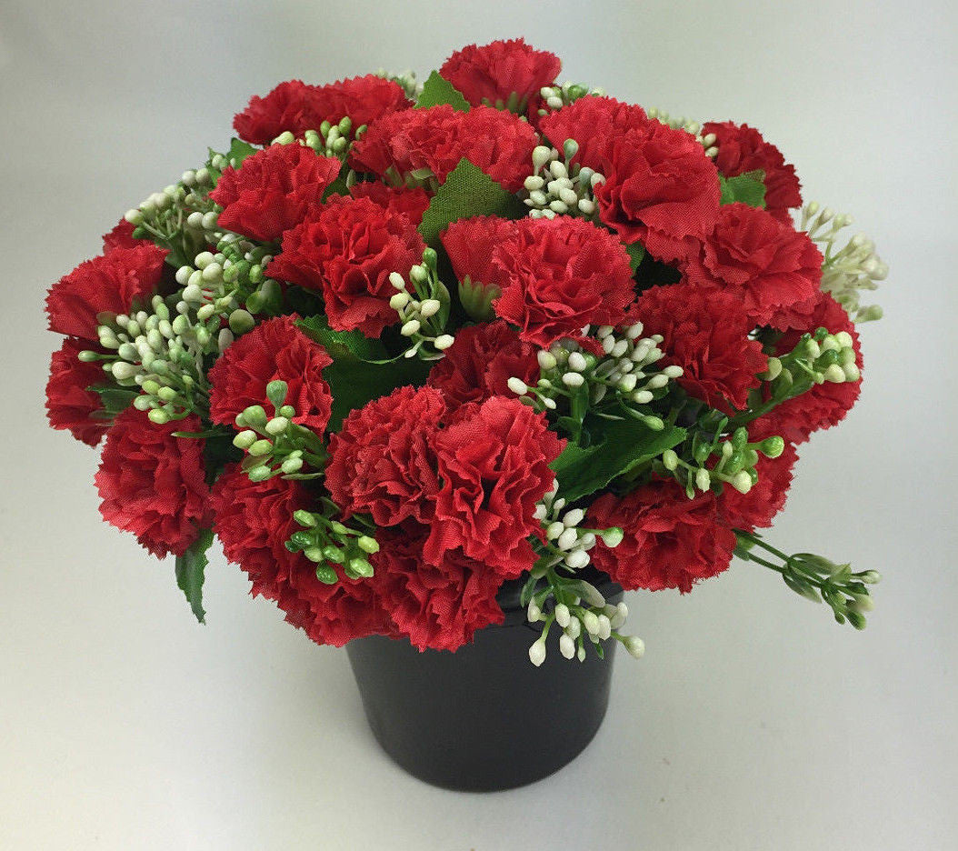 Artificial mini-carnation grave memorial pot arrangement with red carnation blooms, dark pot