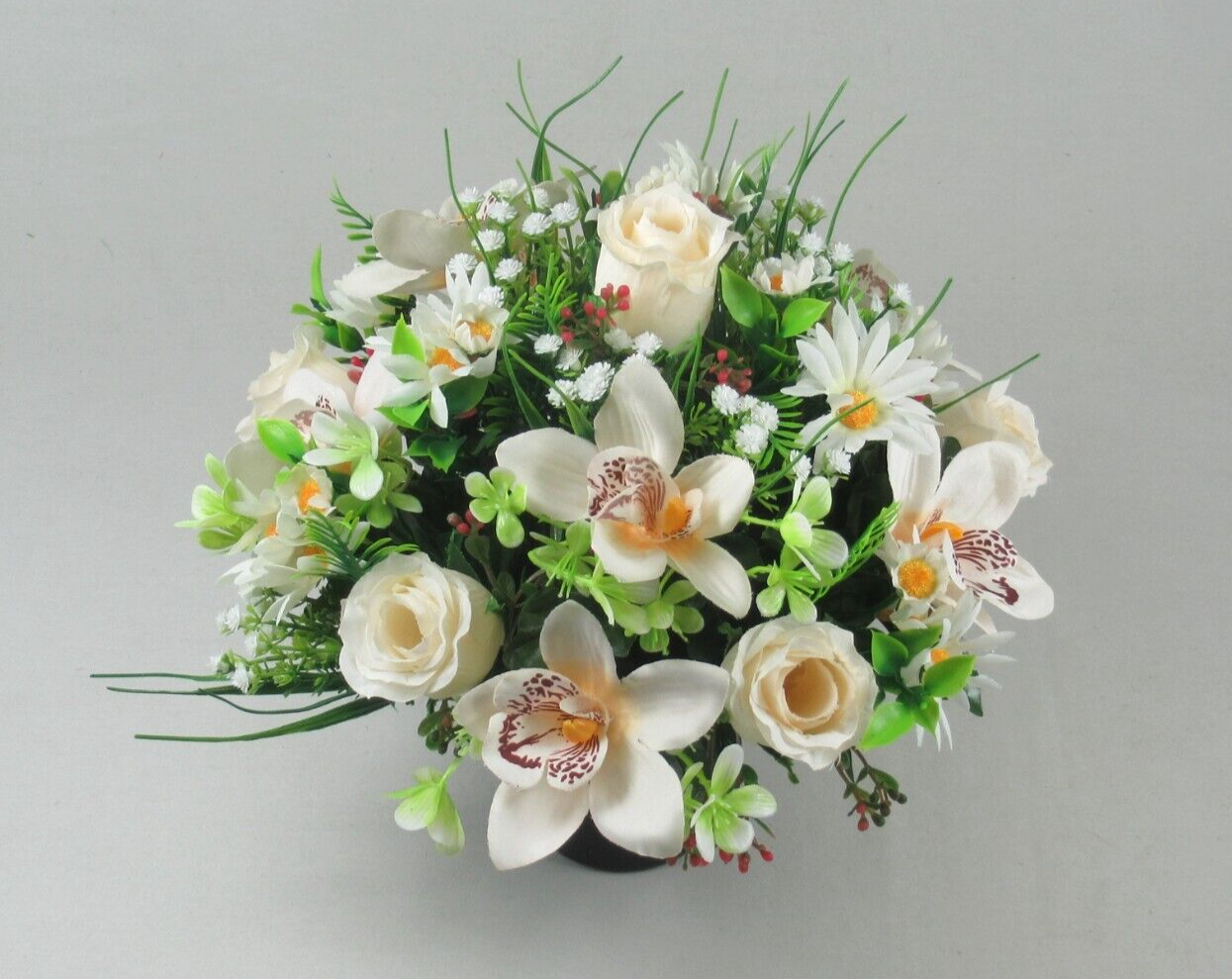 Artificial grave pot flower arrangement with white orchids and roses, green foliage, in black base