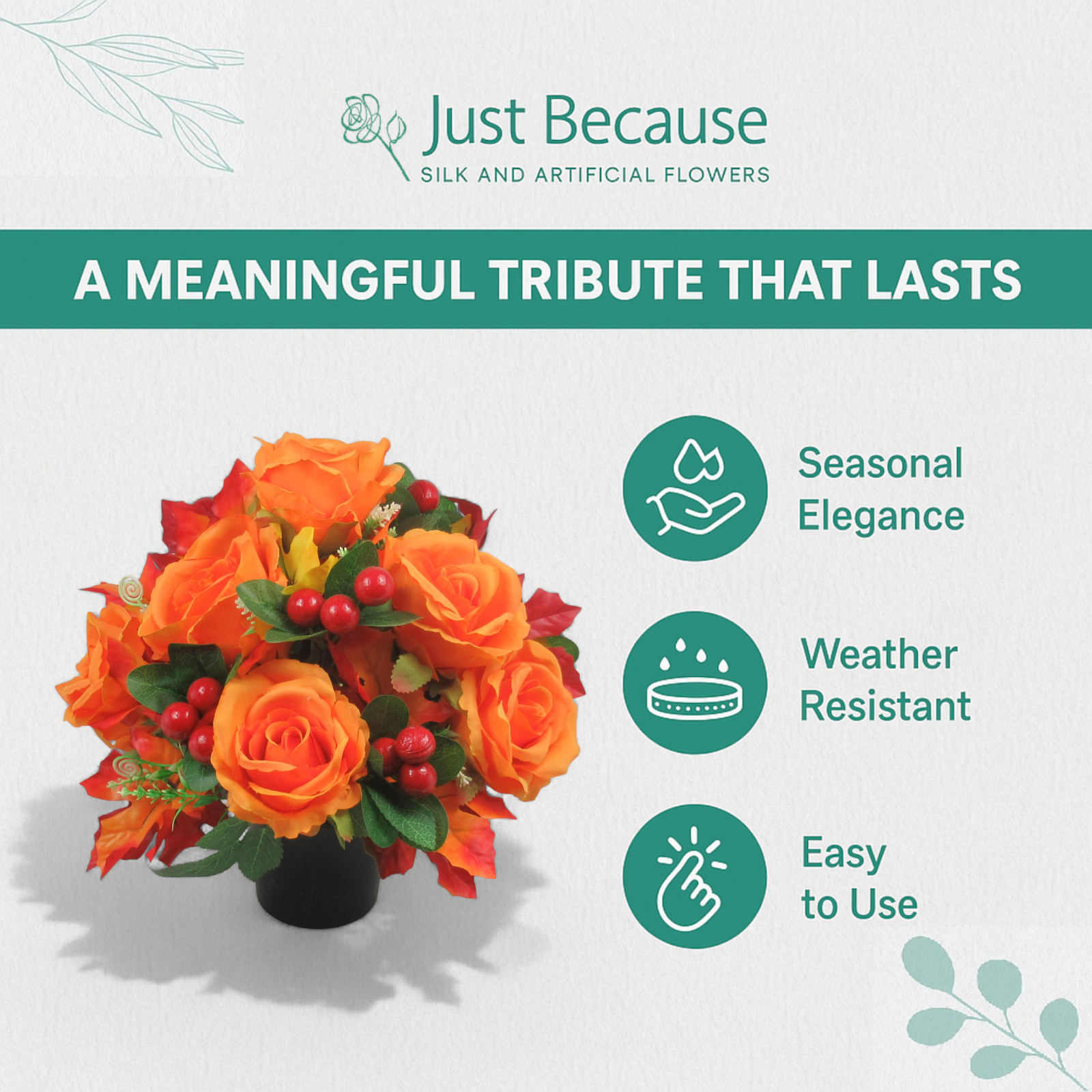 Orange artificial rose and red berry memorial grave arrangement in black pot with green foliage