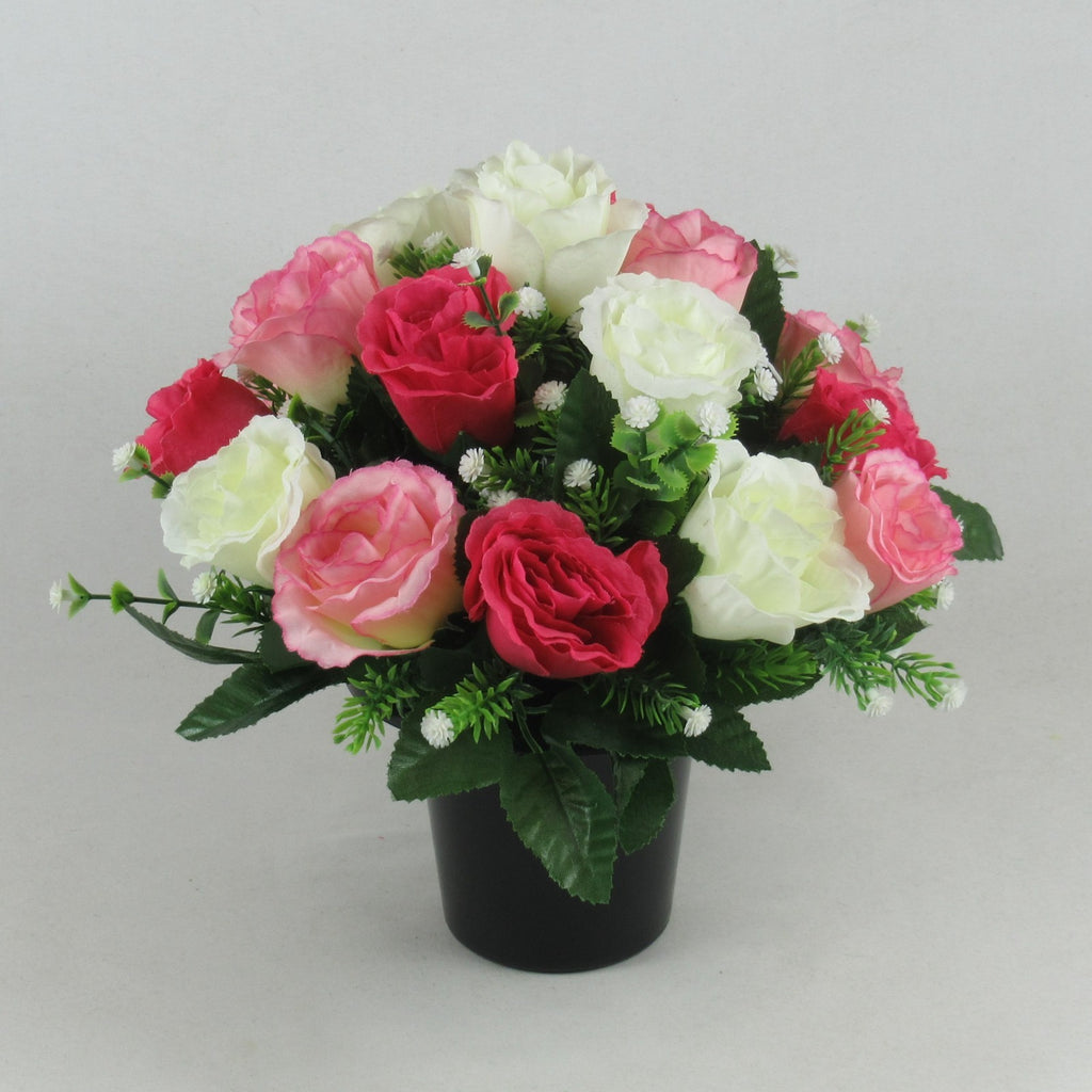 Artificial rose and rosebud memorial arrangement with pink, ivory and red blooms in black vase