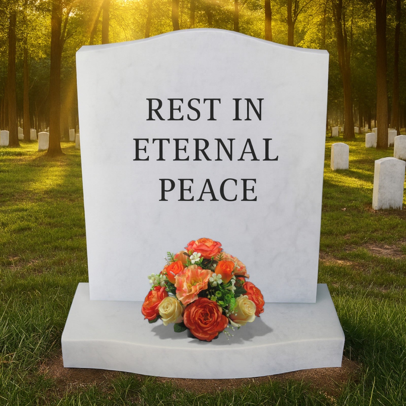 Small artificial rose bouquet at the base of a white memorial headstone reading Rest in Eternal Peace