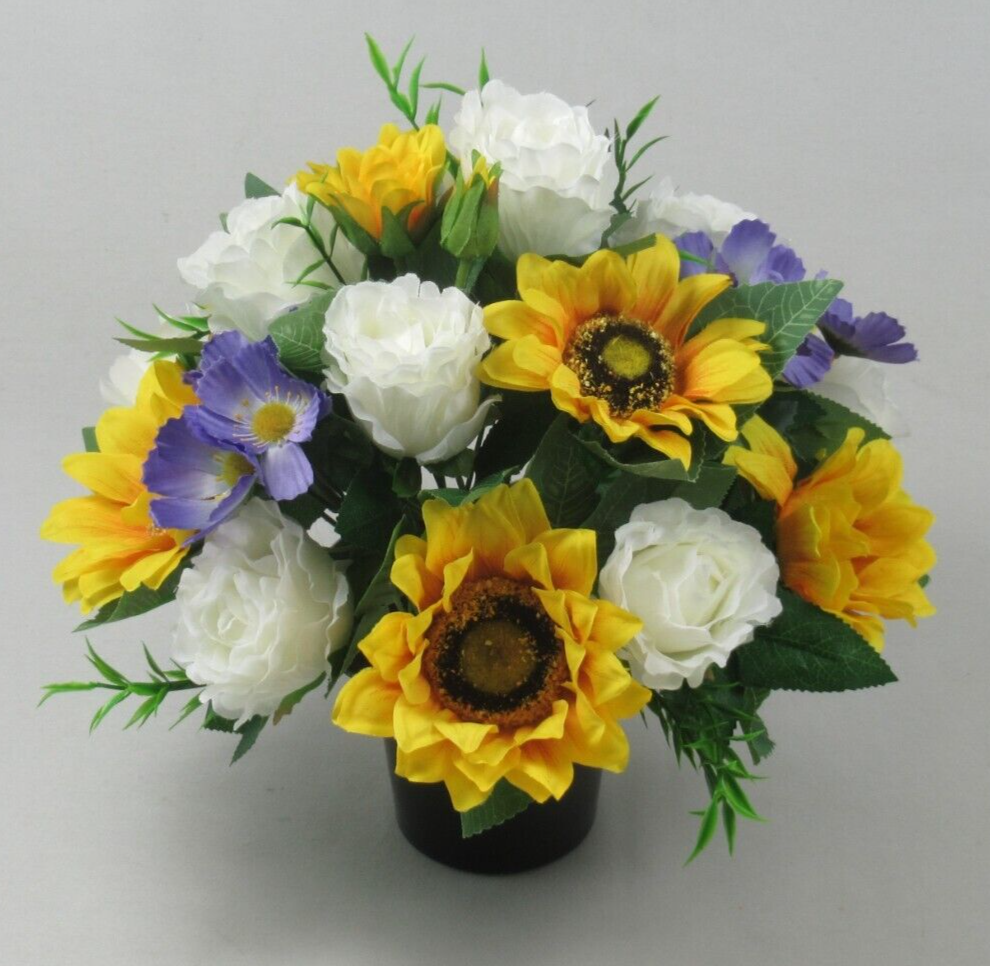 Artificial silk memorial pot bouquet: yellow sunflowers and white roses with blue accents in black pot