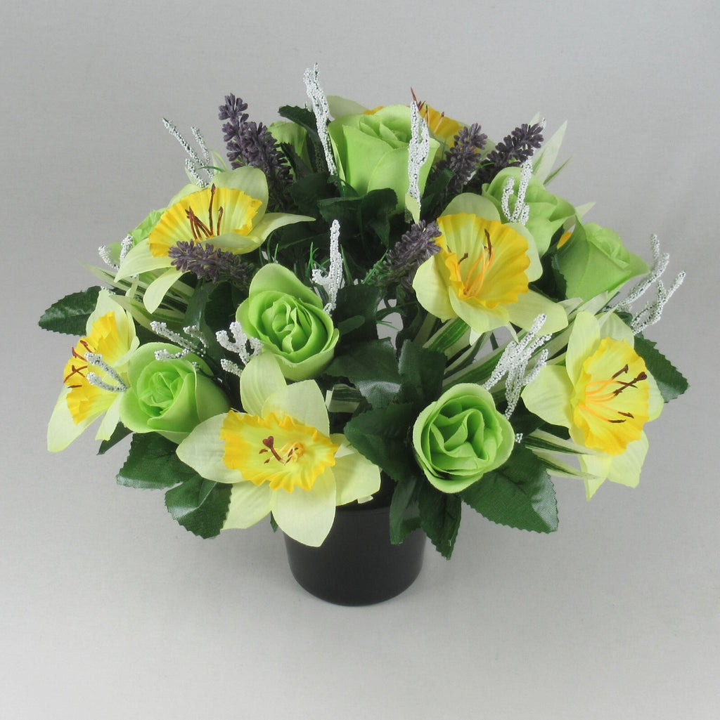 Artificial spring memorial pot bouquet: yellow daffodils, green roses, purple accents, white stems