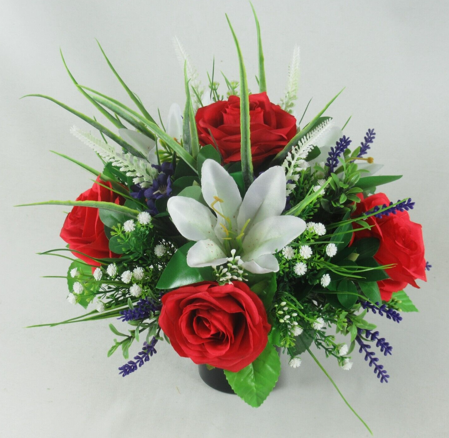 Red rose and white lily artificial grave bouquet in black cremation pot
