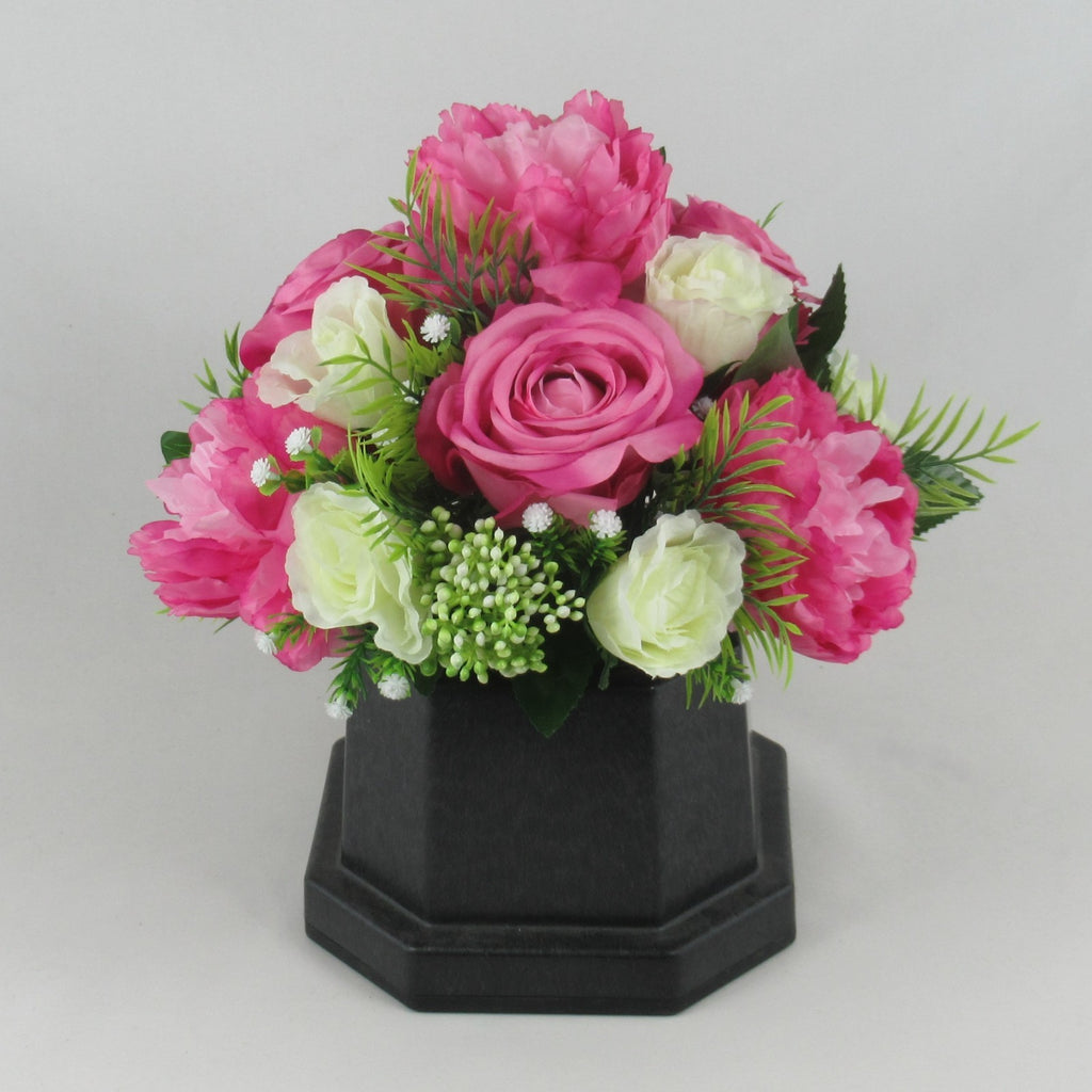 Artificial pink rose and cream peony grave memorial bouquet in black hexagonal pot