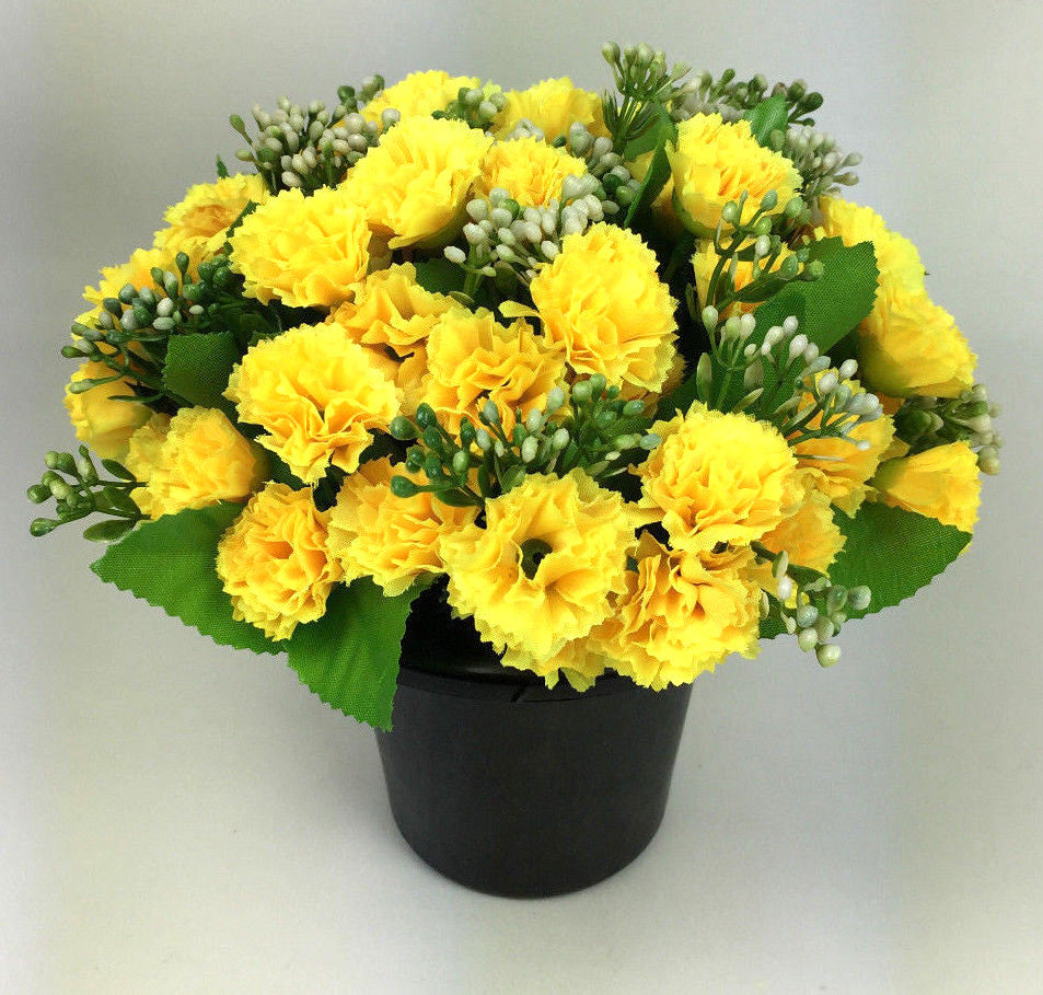 Artificial silk flower grave memorial pot arrangement with yellow carnations and green stems