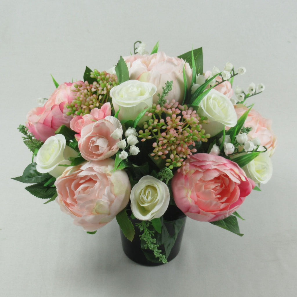 Artificial silk flowers memorial grave arrangement, pastel pink and white roses in black pot