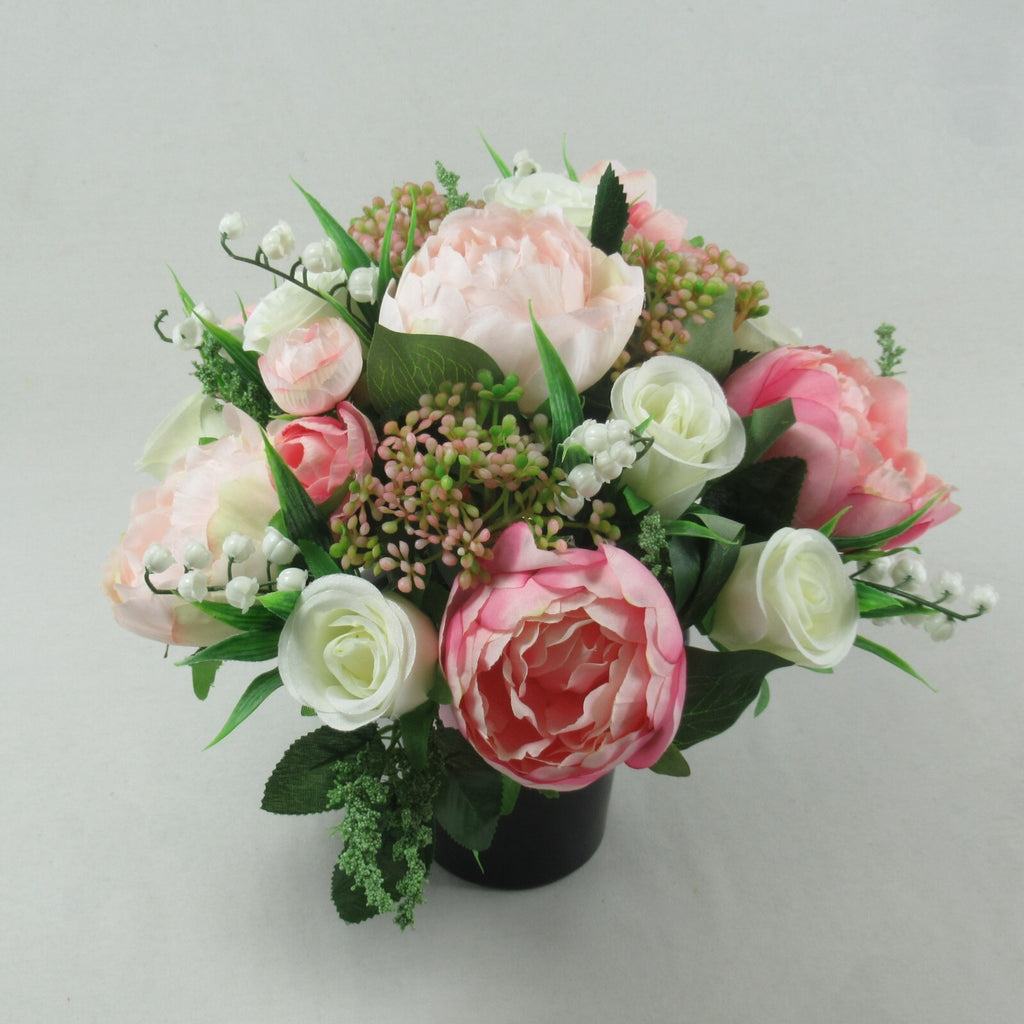 Artificial silk flower grave arrangement in black pot, pale pink and white blooms