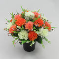 Autumn artificial silk flower grave pot arrangement with coral, peach and white blooms