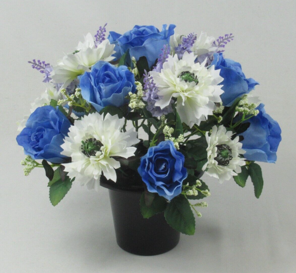 Artificial memorial pot bouquet with blue rose flowers, white daisy-like blooms, green leaves
