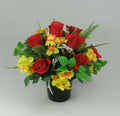 Artificial red rose and yellow flower memorial arrangement in black cremation pot