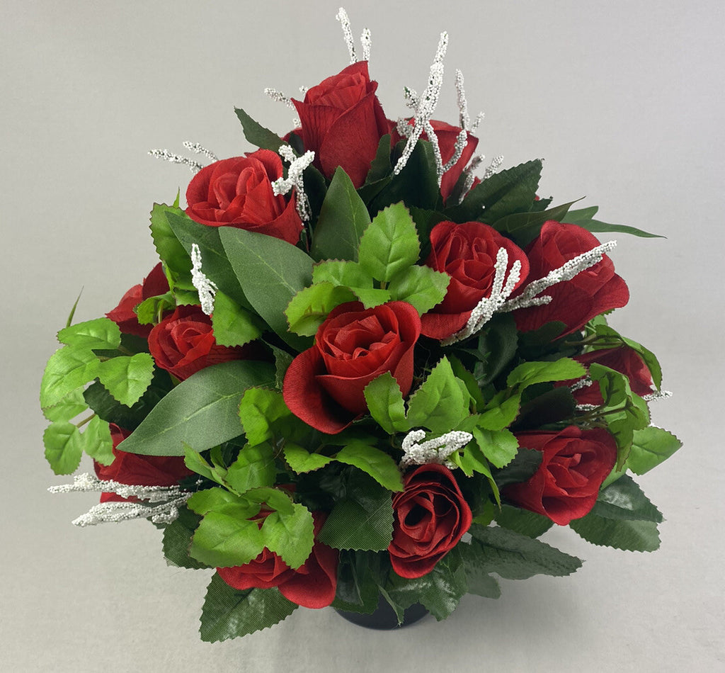 Artificial flower grave pot arrangement, red rose blooms with green foliage and silver accents.